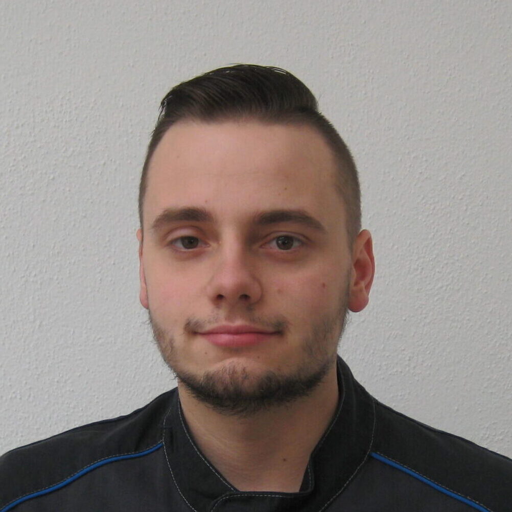 Portraitfoto von Mateusz Malkiewicz